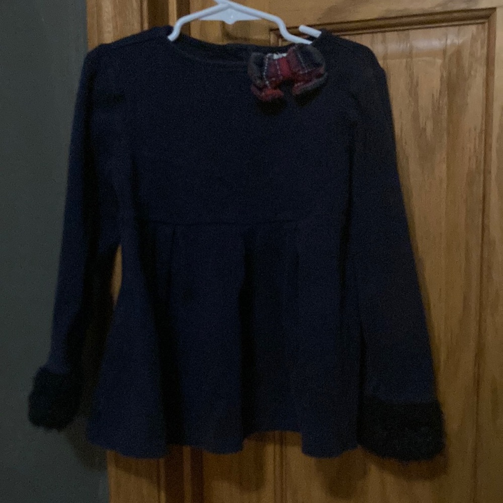 Navy Blue Top with faux fur on the sleeves.